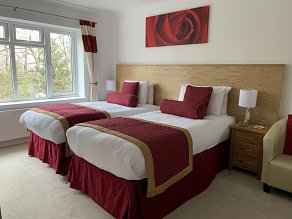 Double bed with red and white linen